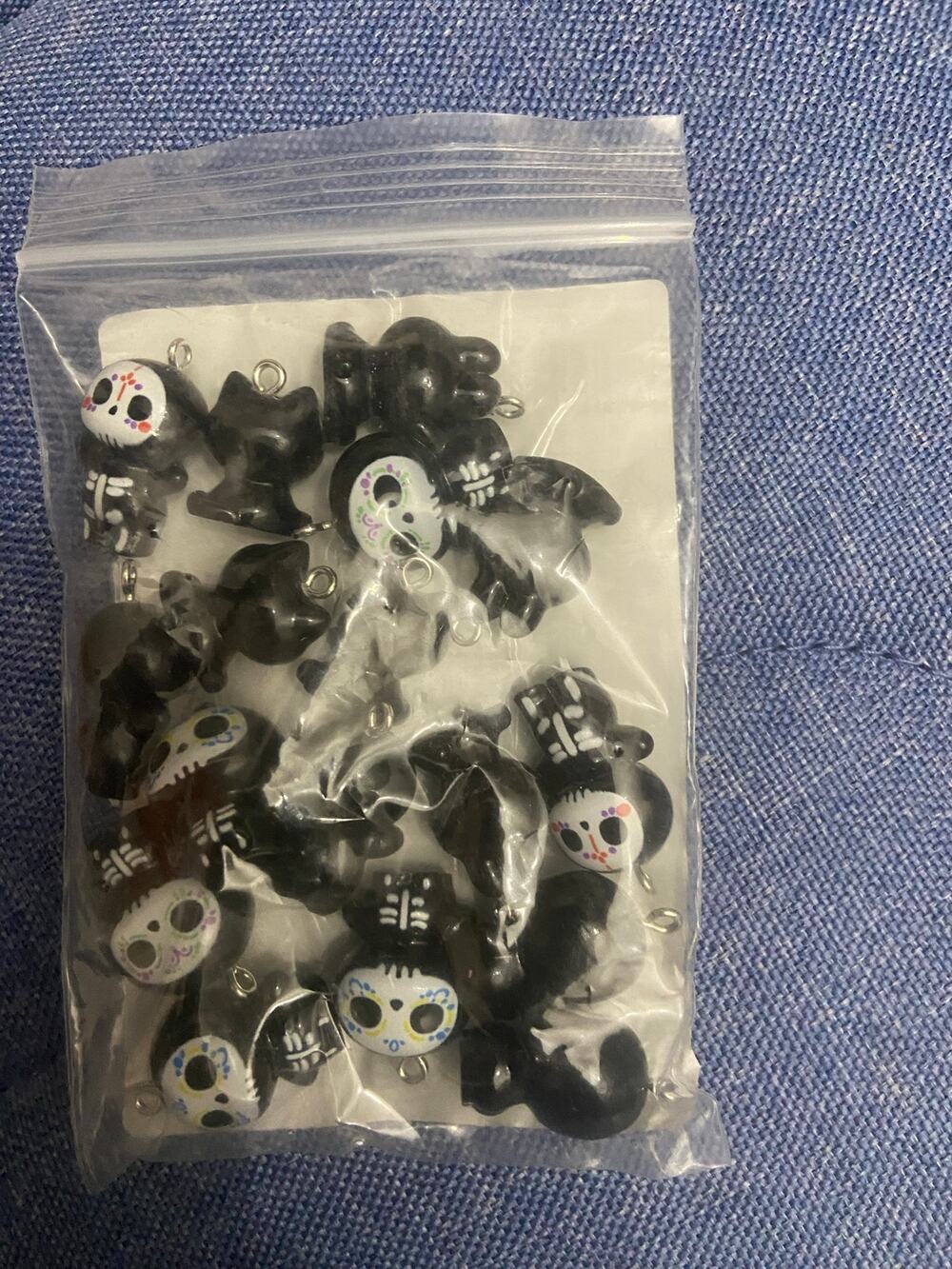 Five piece cute life like zombie charms